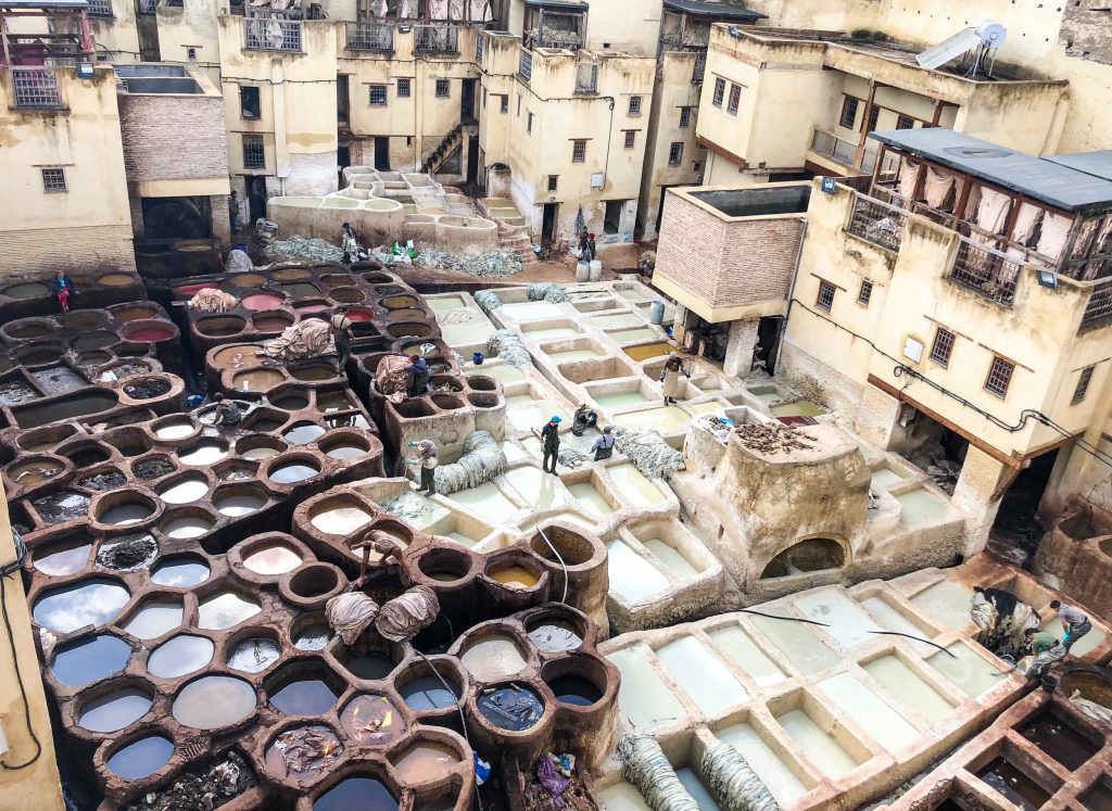 Traditional leather tanning vats at Chouara Tannery in Fes, Morocco.