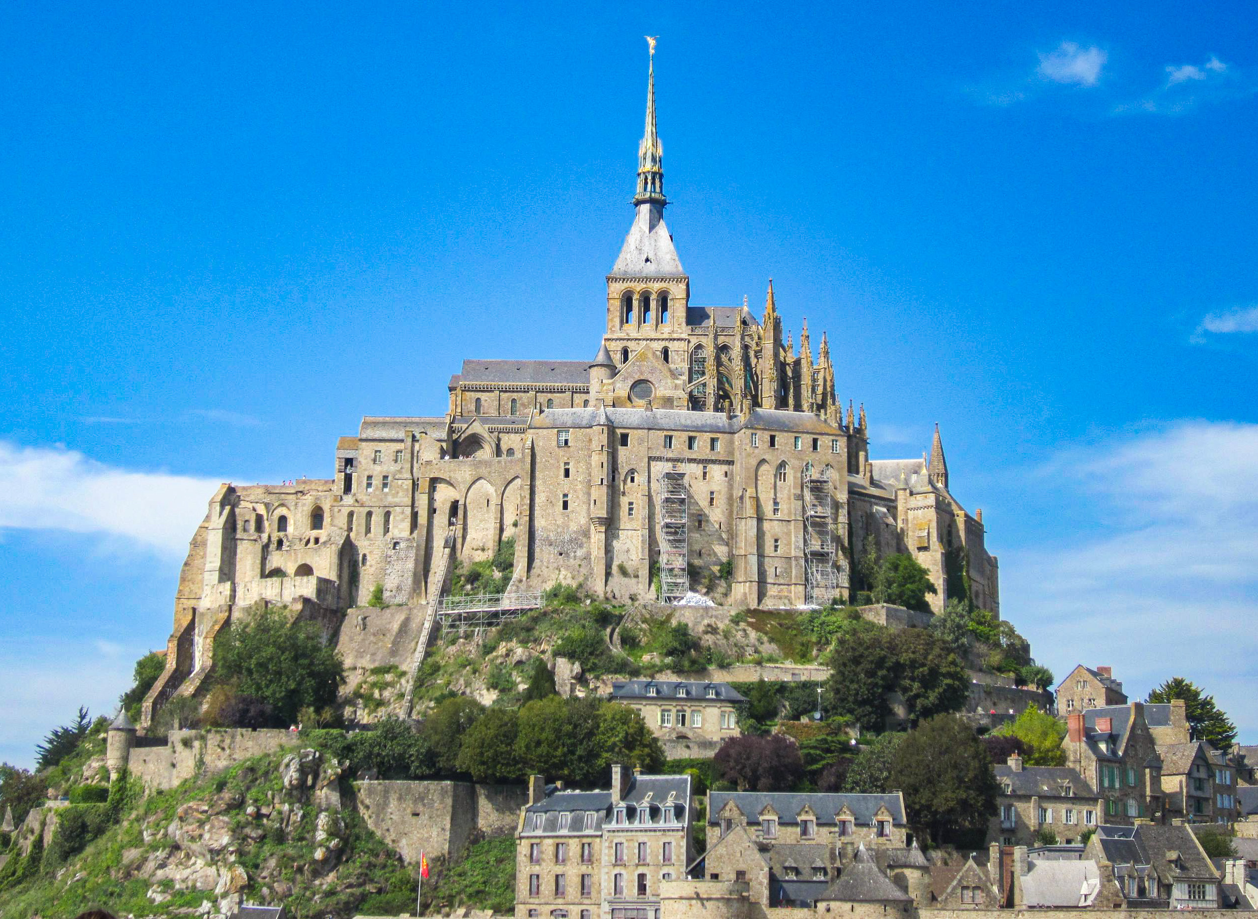 Mont Saint-Michel abbey and medieval village on a rocky island in Normandy, France.